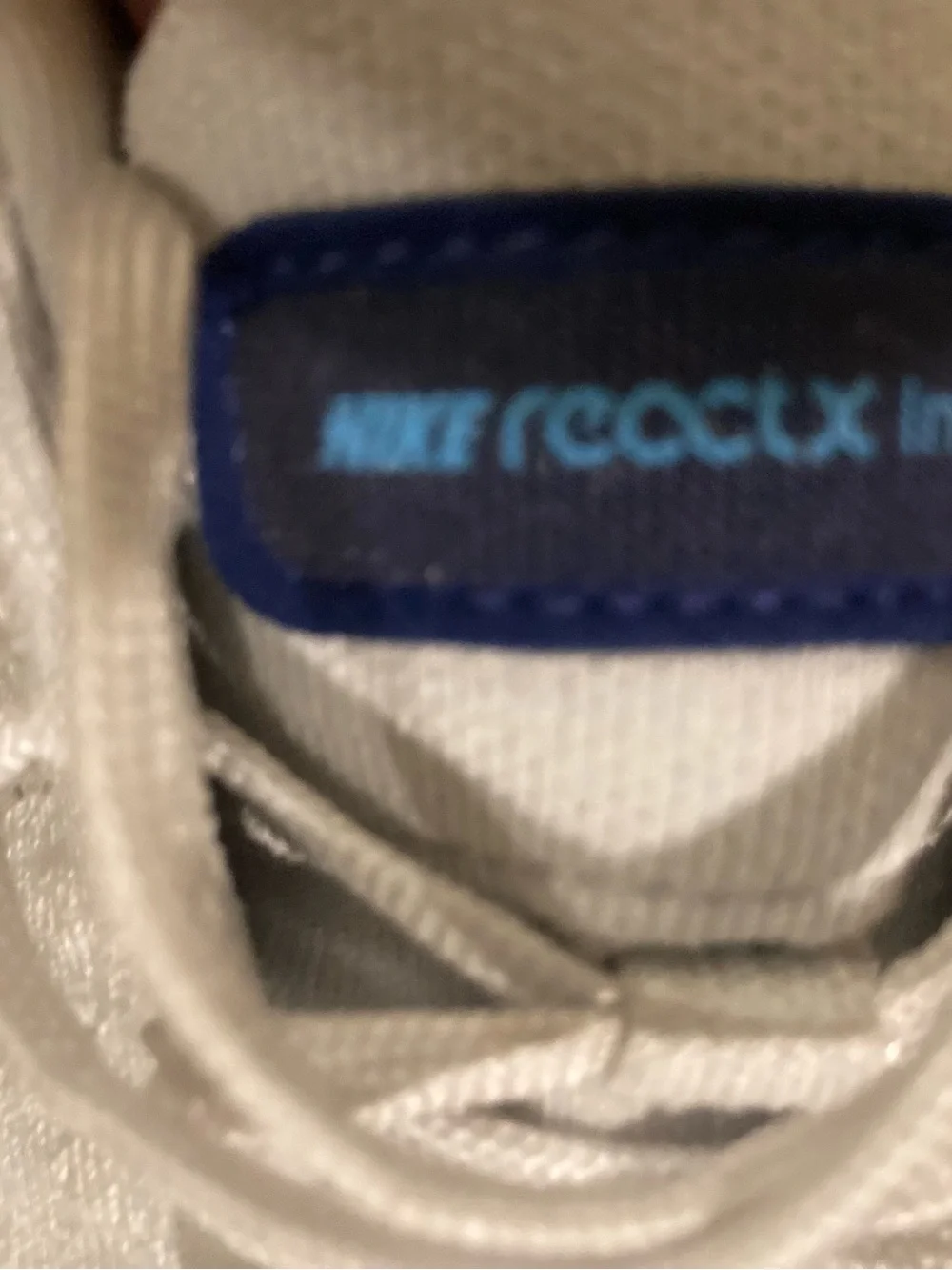 Nike White Athletic Shoes with Blue Swoosh and Yellow Midsole